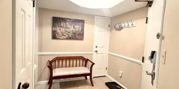 Image 3: A welcoming entryway with practical tile flooring.