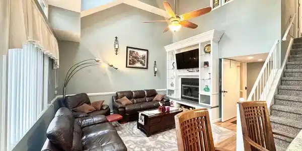 Image 4: Natural light floods this living area, showcasing