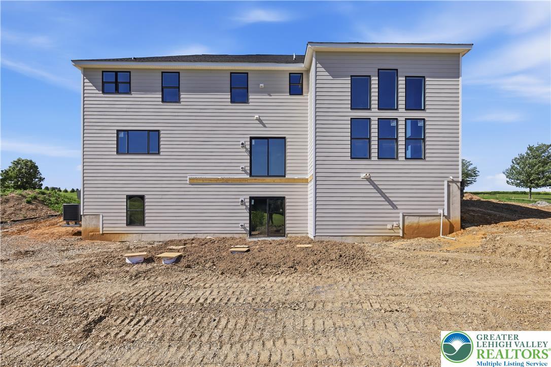 Image 3: Newly constructed home with light-colored horizont