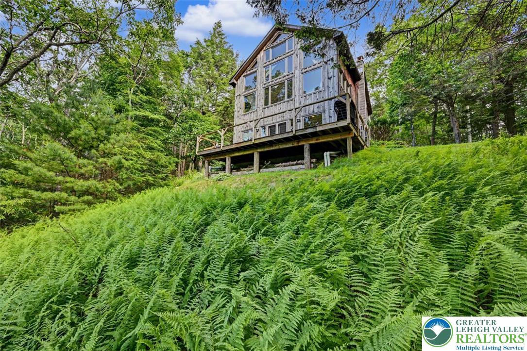 Image 3: Elevated Back Deck w/ Stunning Views. Nestled amon