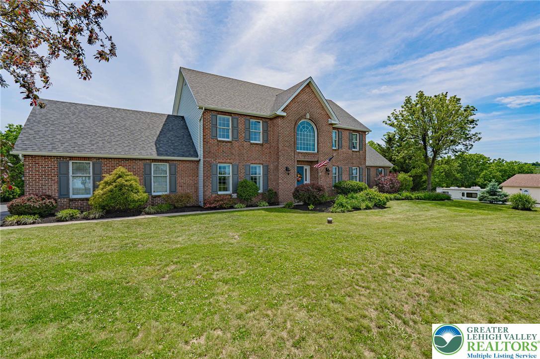 Image 3: Brick facade with striking arched window, this sta