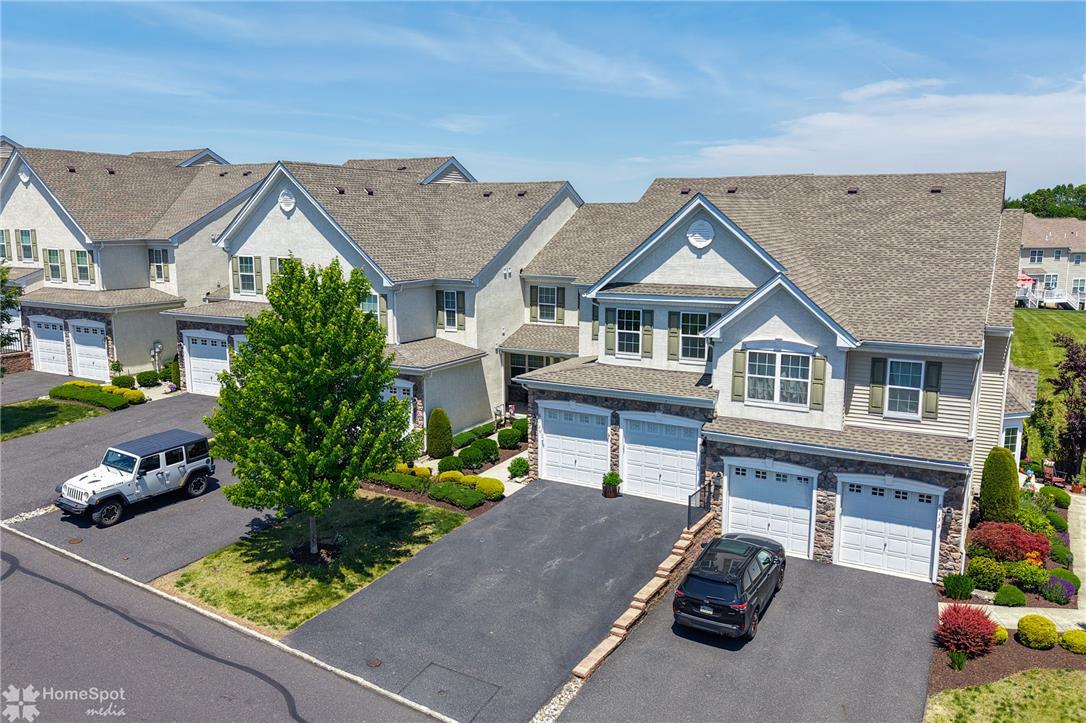 Image 3: Rows of townhomes present charming curb appeal, fe