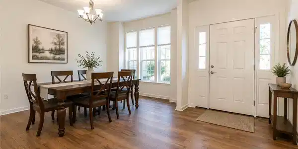Image 4: Rich LVP floors seamlessly connect the welcoming e