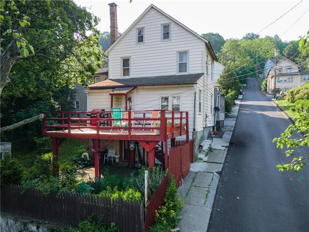 Image 2: A spacious raised deck offers prime outdoor entert