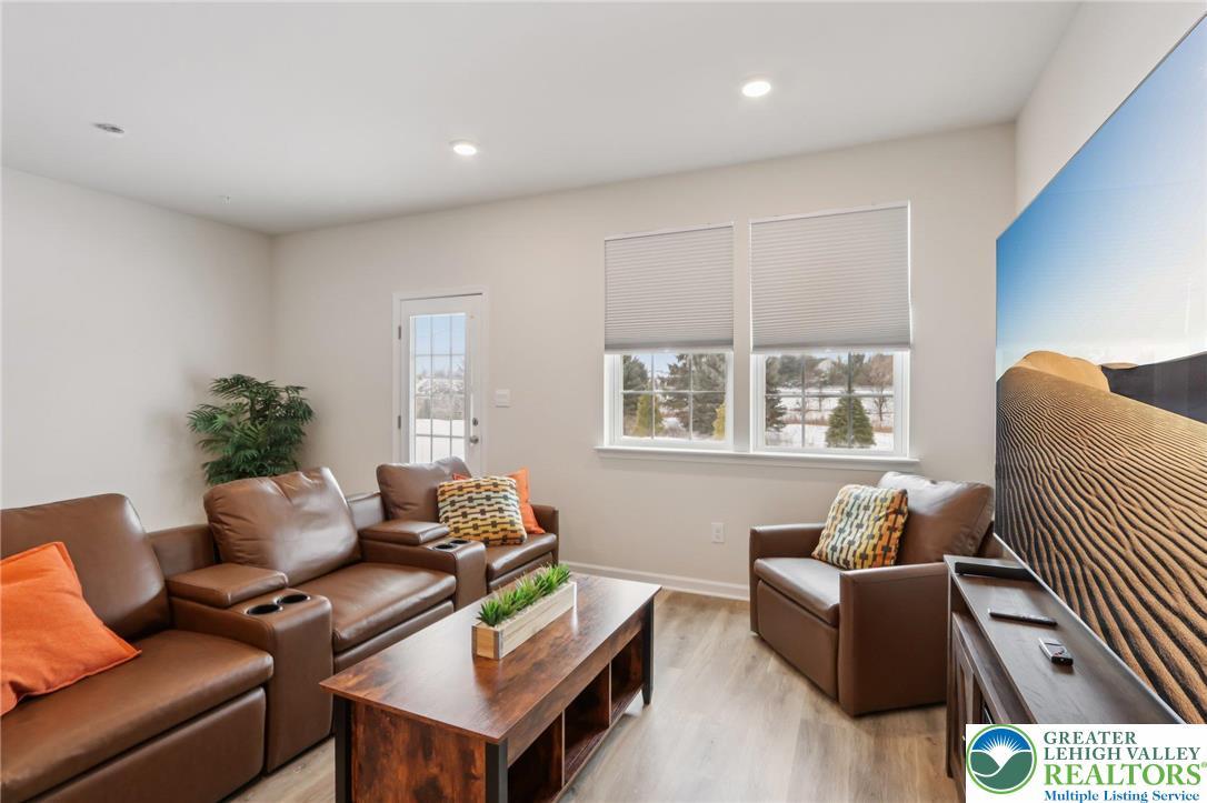 Image 4: 9 ft ceilings, lots of recessed lighting. Window t