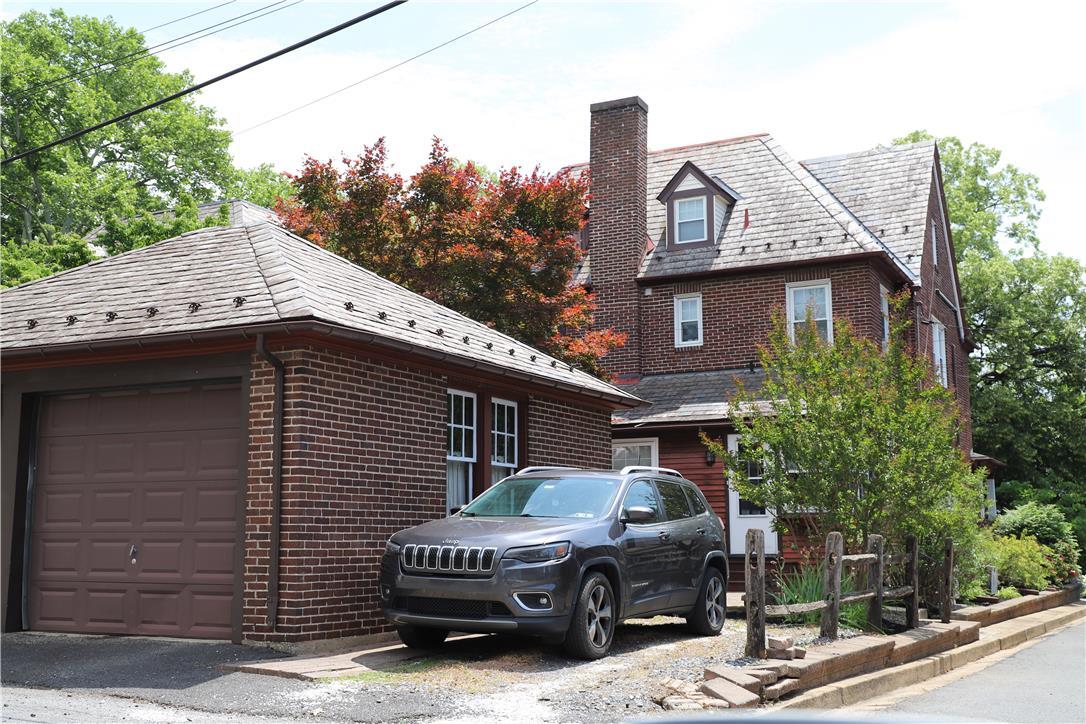 Image 2: A classic brick exterior offers enduring appeal wi