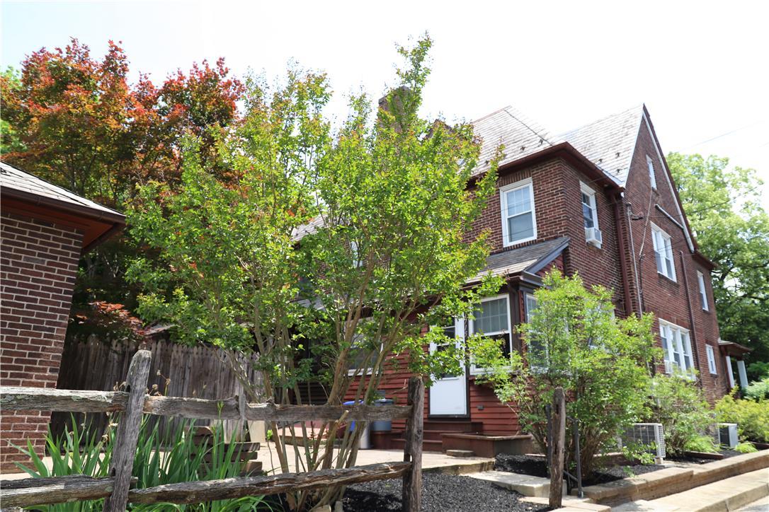 Image 4: A classic brick exterior with multi-paned windows