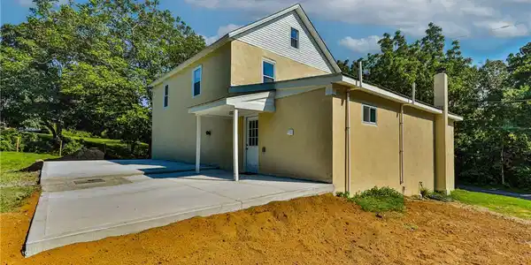 Image 2: concrete patio provides ample outdoor space