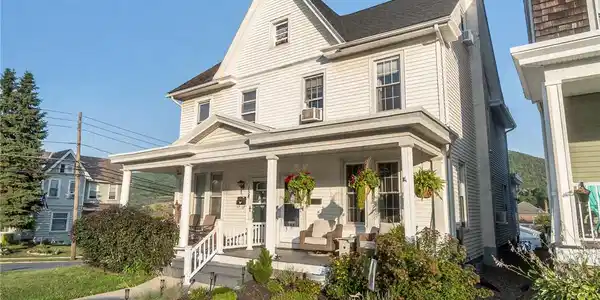Image 3: A classic facade with a welcoming covered porch, p