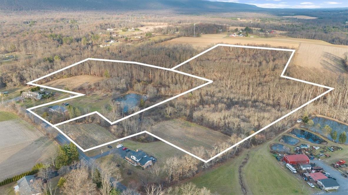 Image 2: An aerial perspective reveals a vast rural propert
