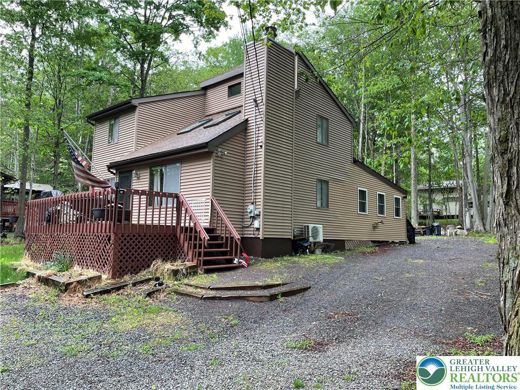 Image 1: A secluded dwelling nestled amidst abundant trees,