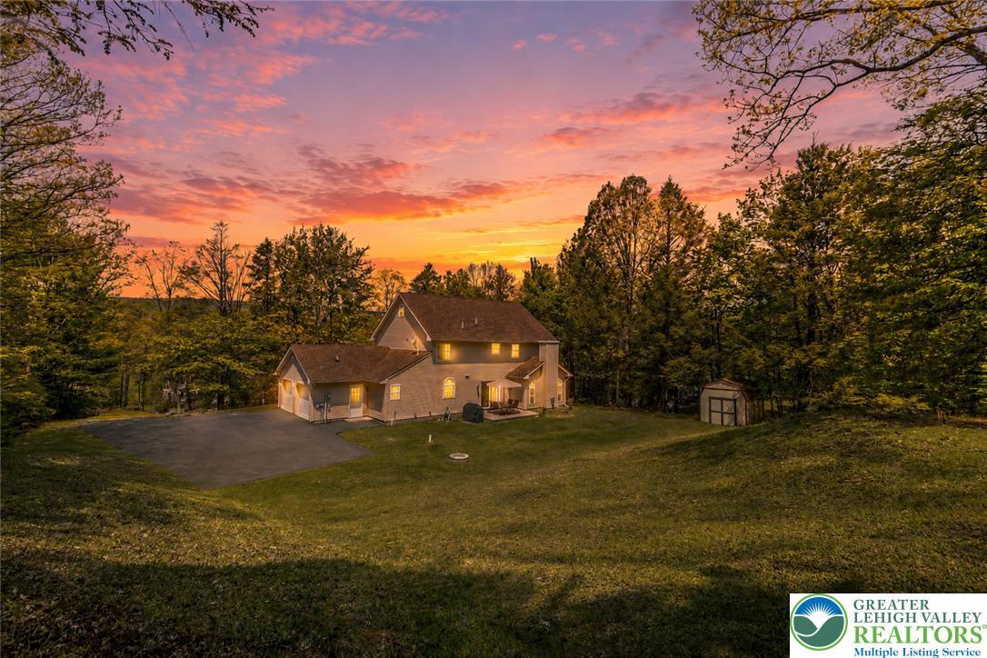 Image 4: Dramatic sunset hues illuminate this residence, ne