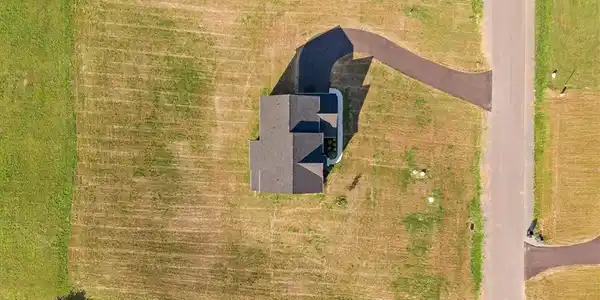 Image 4: An aerial perspective reveals a residence nestled