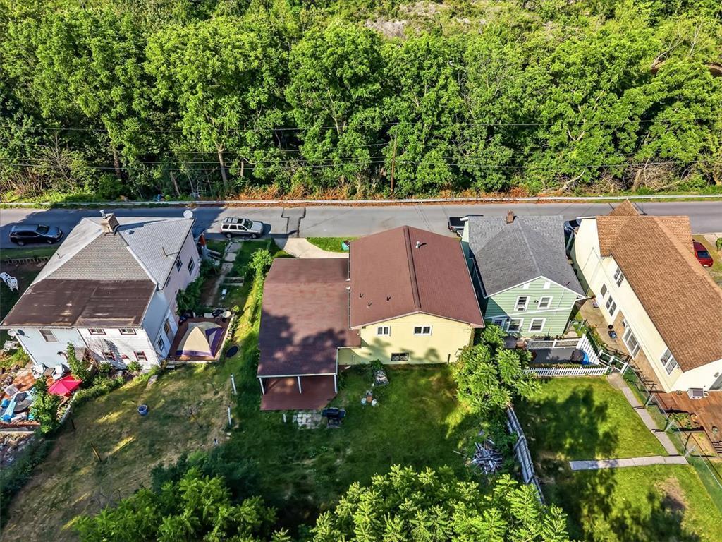 Image 3: An aerial perspective reveals several homes nestle