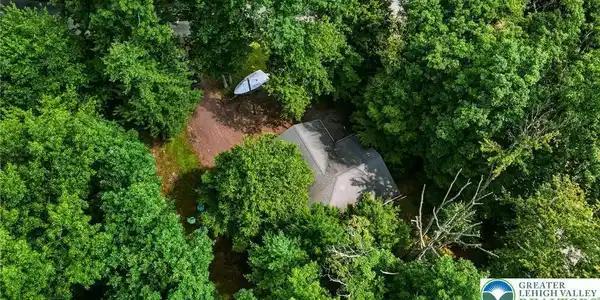 Image 2: Perched amidst a verdant landscape, a private resi