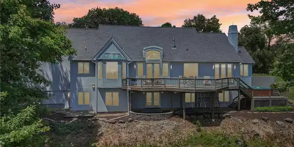 Image 4: A spacious home with multiple windows and an invit