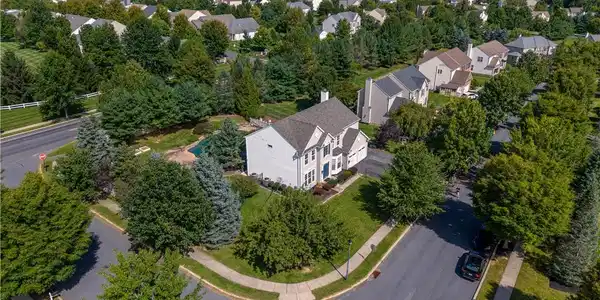 Image 3: An aerial perspective showcases the corner lot loc