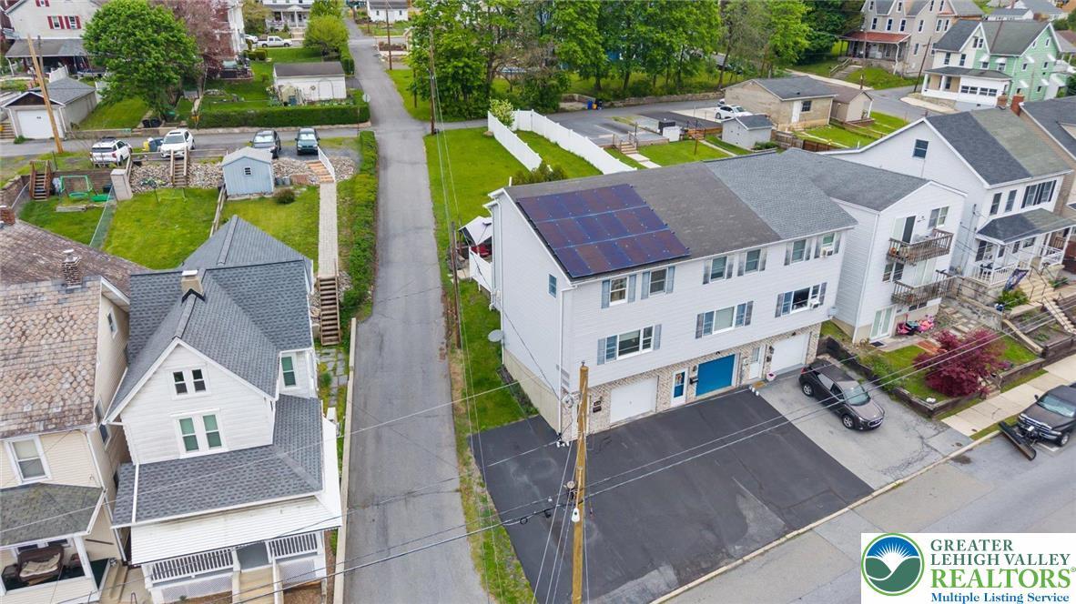 Image 4: This residential property features solar panels, o