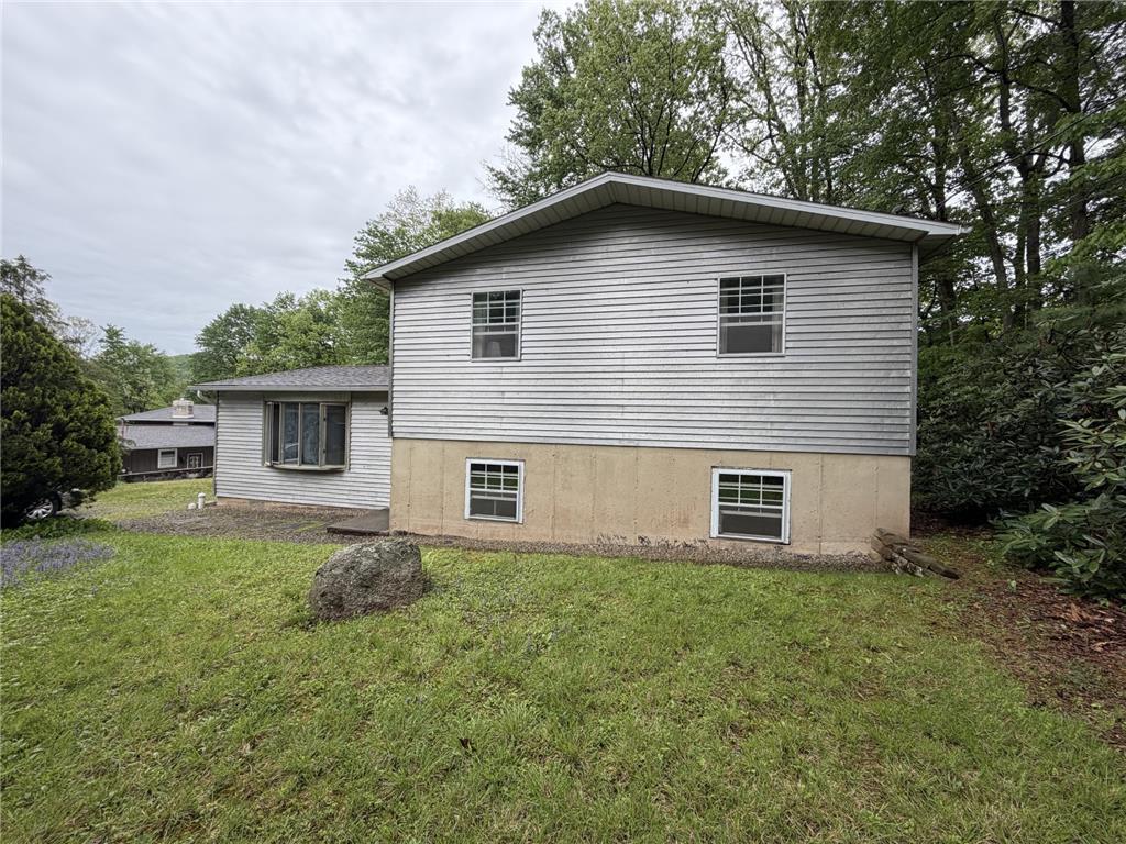 Image 2: A classic facade with sturdy siding and a visible