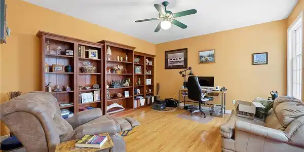 Image 4: Natural light illuminates this versatile room with