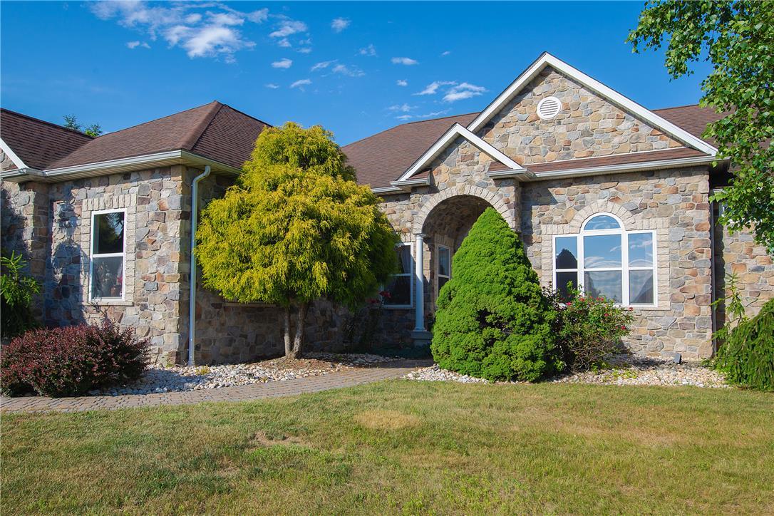 Image 4: A classic stone facade with an arched entryway wel