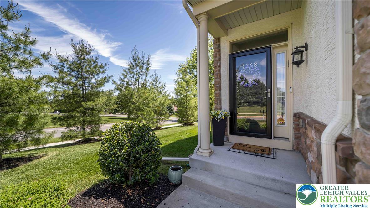 Image 2: Welcoming curb appeal with a front covered entranc