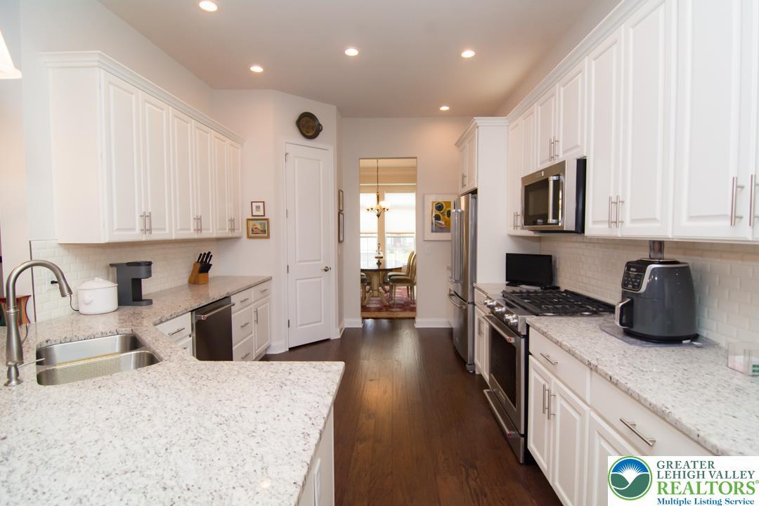 Image 4: A contemporary kitchen showcasing light granite co