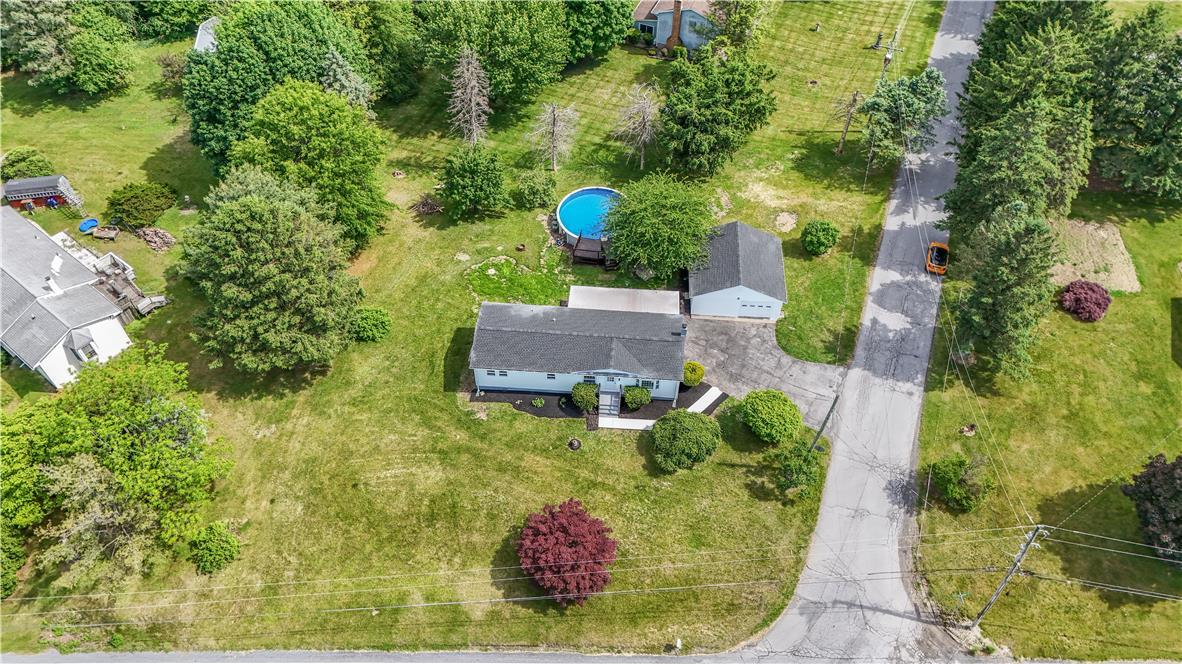 Image 2: An aerial perspective showcases a home with an inv