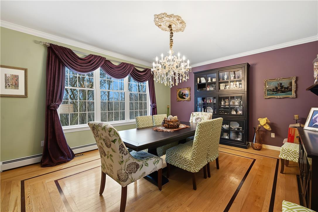 Image 3: Elegant hardwood flooring sets the stage for forma