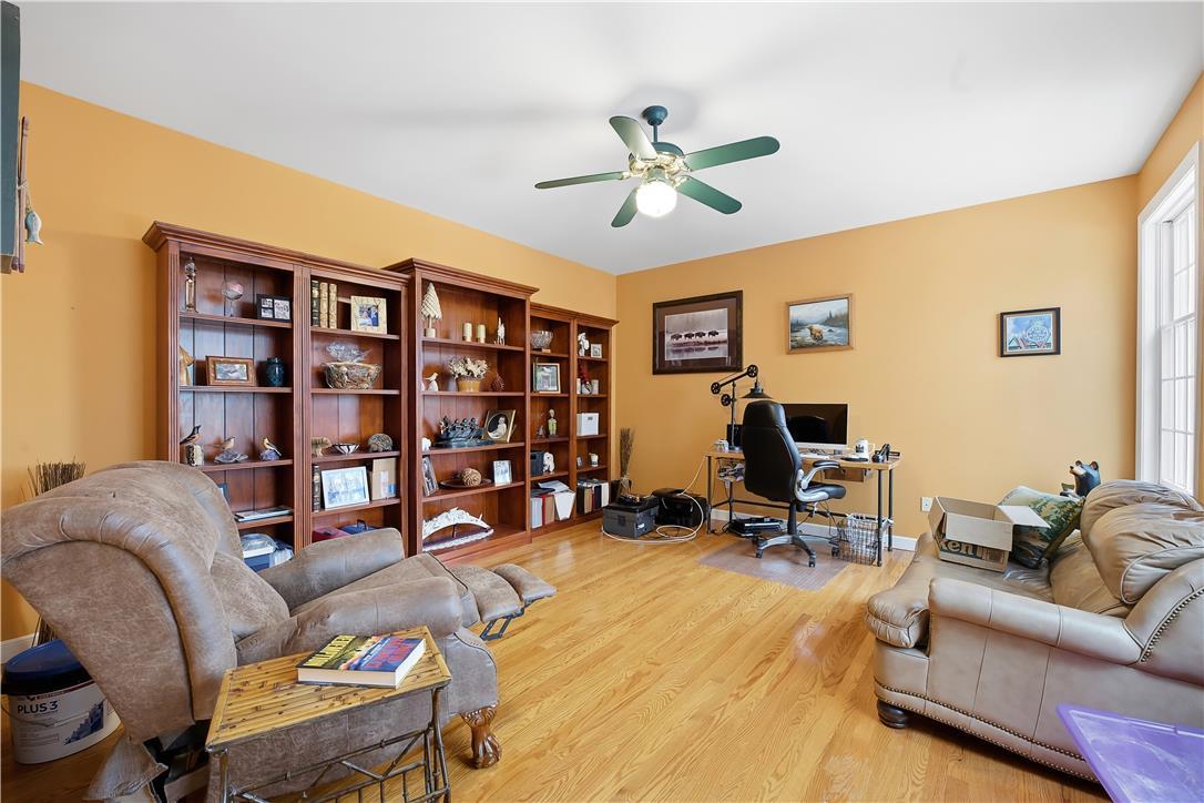 Image 4: Natural light illuminates this versatile room with