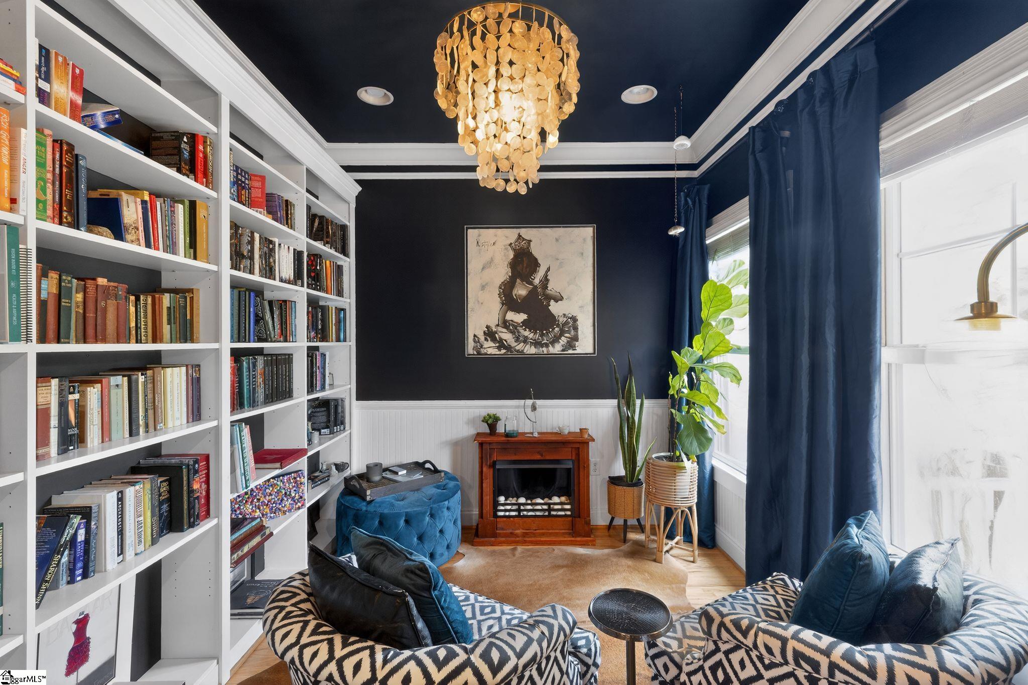 Image 2: Sophisticated library retreat with custom built-ins and a dramatic color palette&mdash;an ideal space to unwind.
