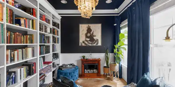 Image 2: Sophisticated library retreat with custom built-ins and a dramatic color palette&mdash;an ideal space to unwind.