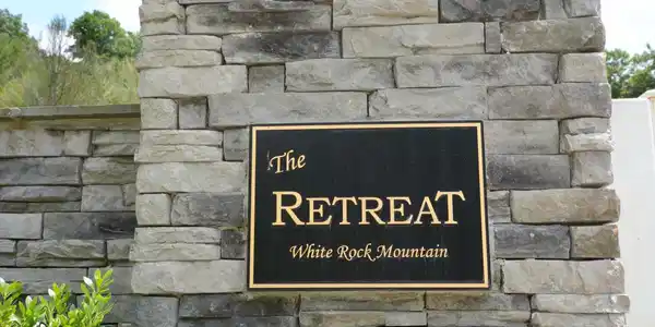 Image 3: the Retreat SIGN