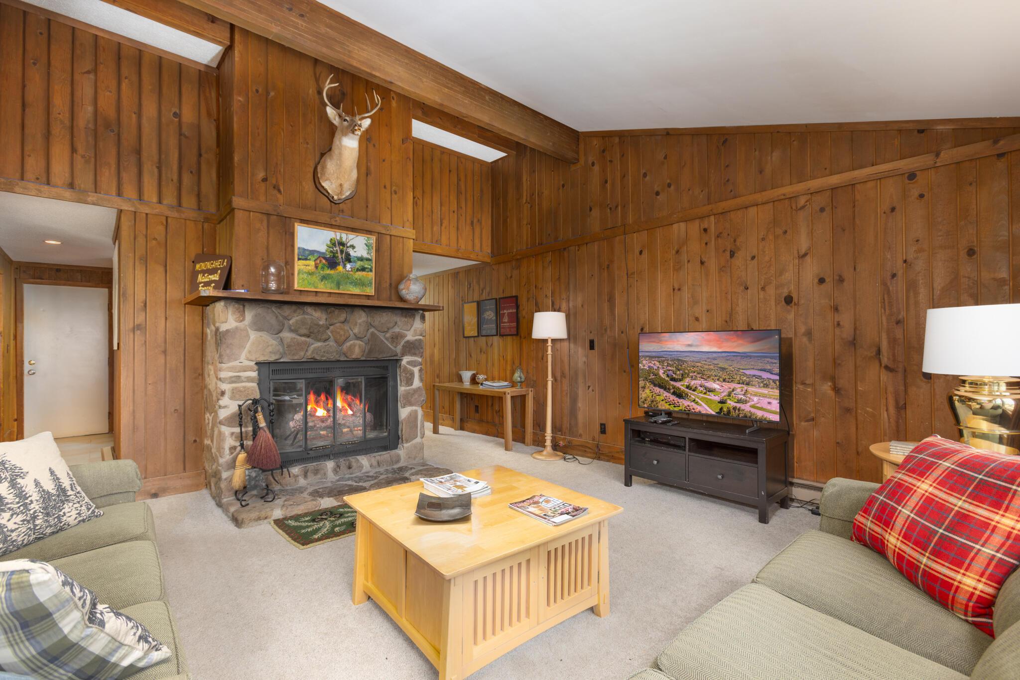 Image 2: Living room with wood fireplace