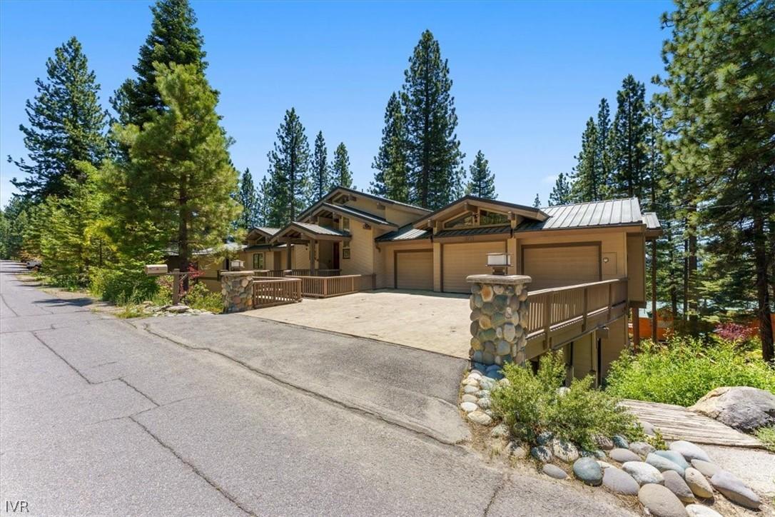 Image 2: Front of Home with oversized driveway