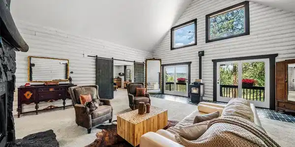 Image 2: Great Room with a main fireplace and woodburning stove Image 2: Great Room with a main fireplace and woodburning stove