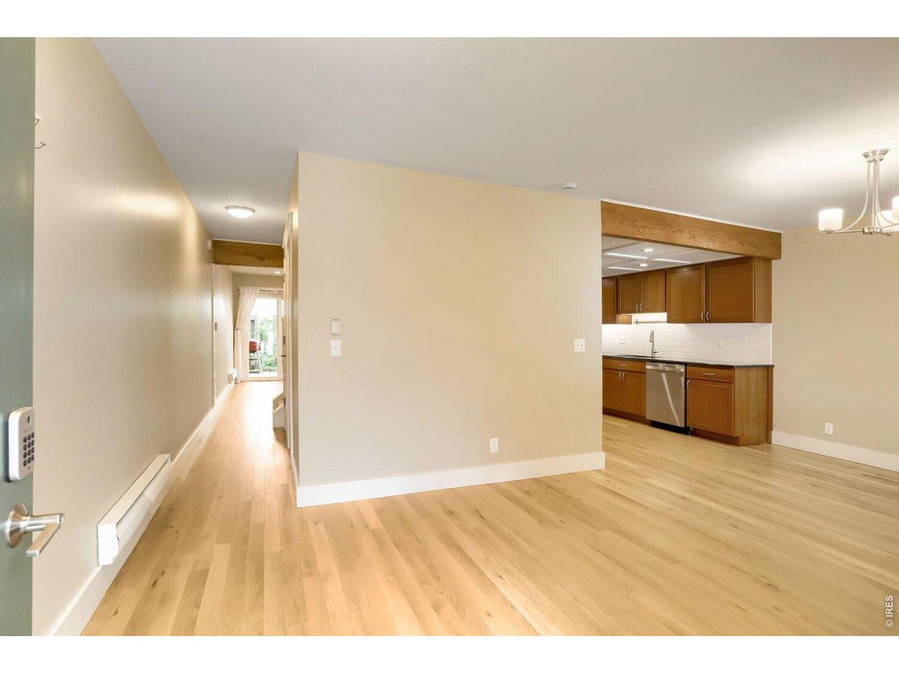 Image 4: The main level features open dining, kitchen and living rooms, and flows seamlessly through to the fenced back yard