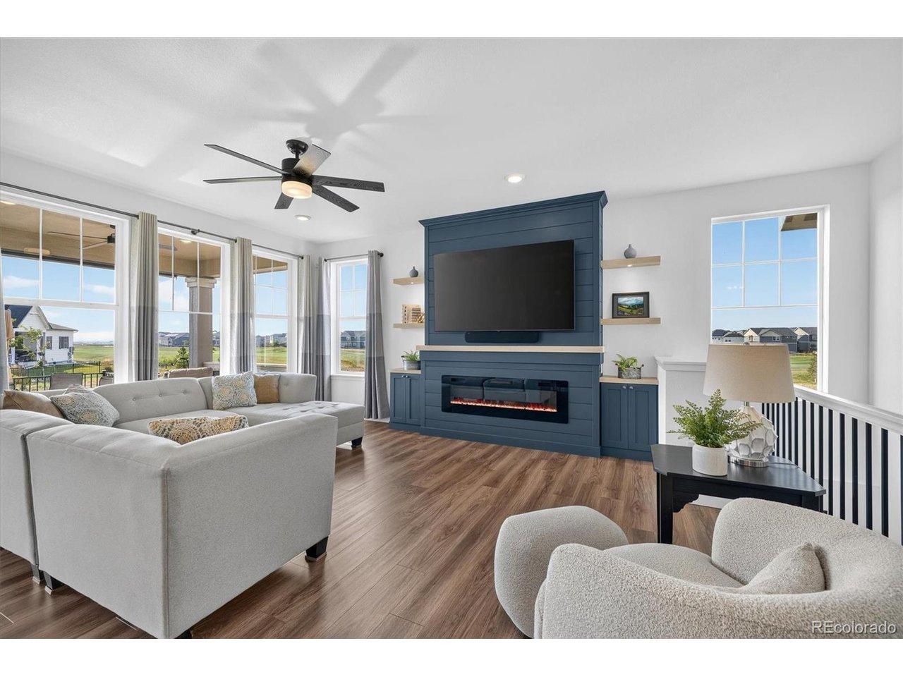 Image 3: Enjoy a wall of windows in the Living Room with custom fireplace Image 3: Enjoy a wall of windows in the Living Room with custom fireplace