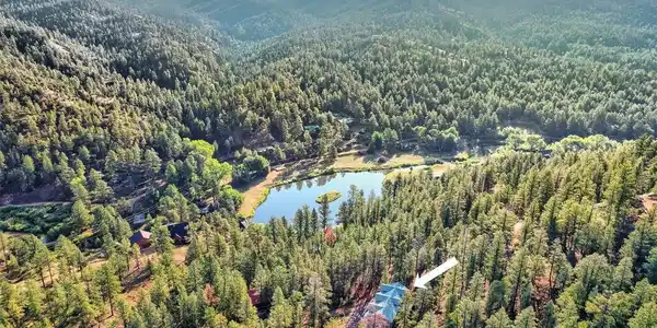 Image 2: Private community pond just moments from home-fish, relax, picnic, or simply take in the mountain scenery.
