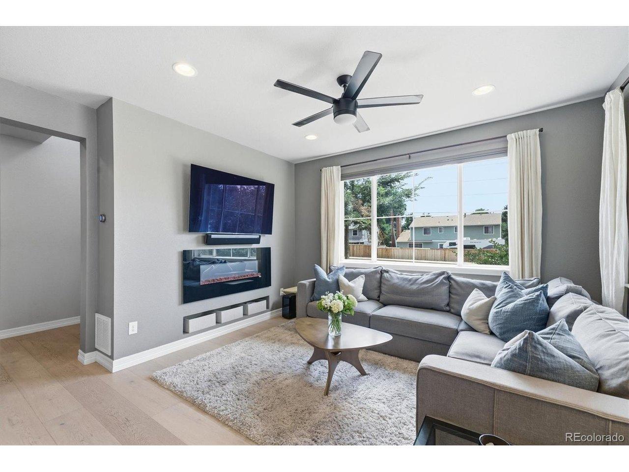Image 2: Bright living room with engineered hardwood flooring and abundant natural light Image 2: Bright living room with engineered hardwood flooring and abundant natural light