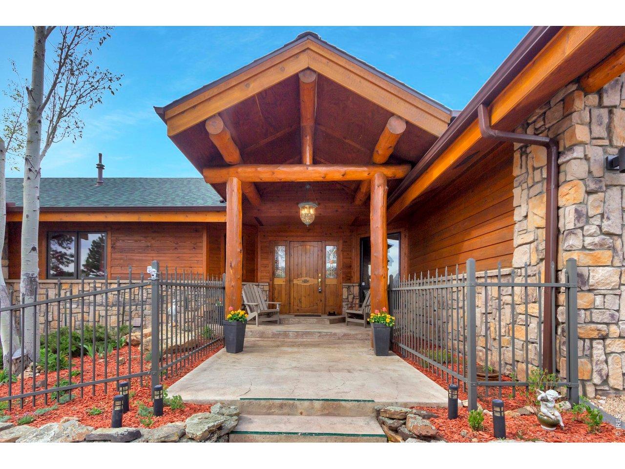 Image 2: Stunning custom mountain estate in The Reserve featuring timeless log and stone craftsmanship with a warm, welcoming entrance. Image 2: Stunning custom mountain estate in The Reserve featuring timeless log and stone craftsmanship with a warm, welcoming entrance.