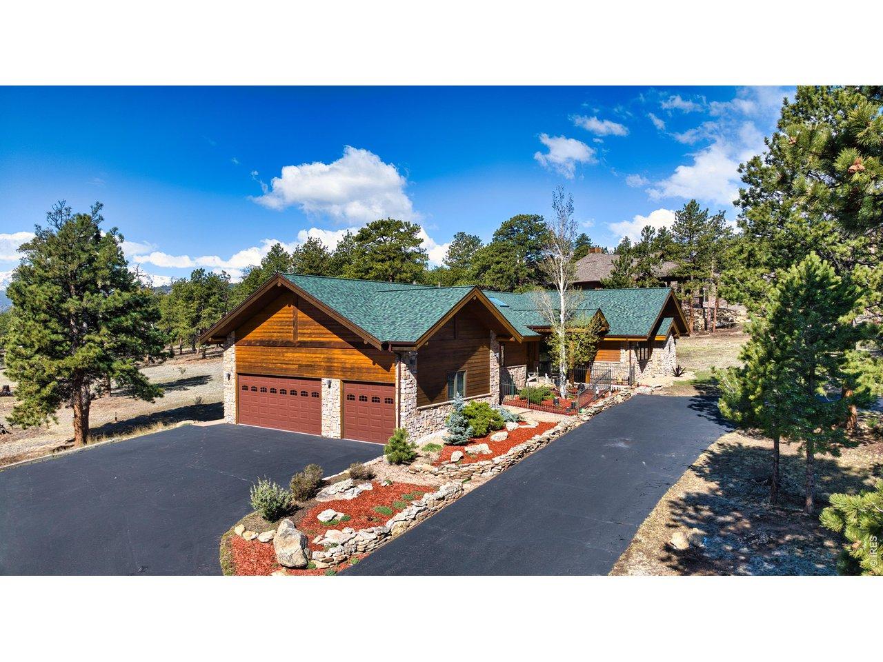 Image 3: Exceptional curb appeal with custom log and stone architecture, expansive driveway access, and refined mountain elegance. Image 3: Exceptional curb appeal with custom log and stone architecture, expansive driveway access, and refined mountain elegance.