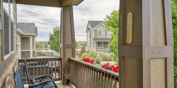 Image 2: A covered front porch is the perfect place to relax and enjoy the lake & mountain views!