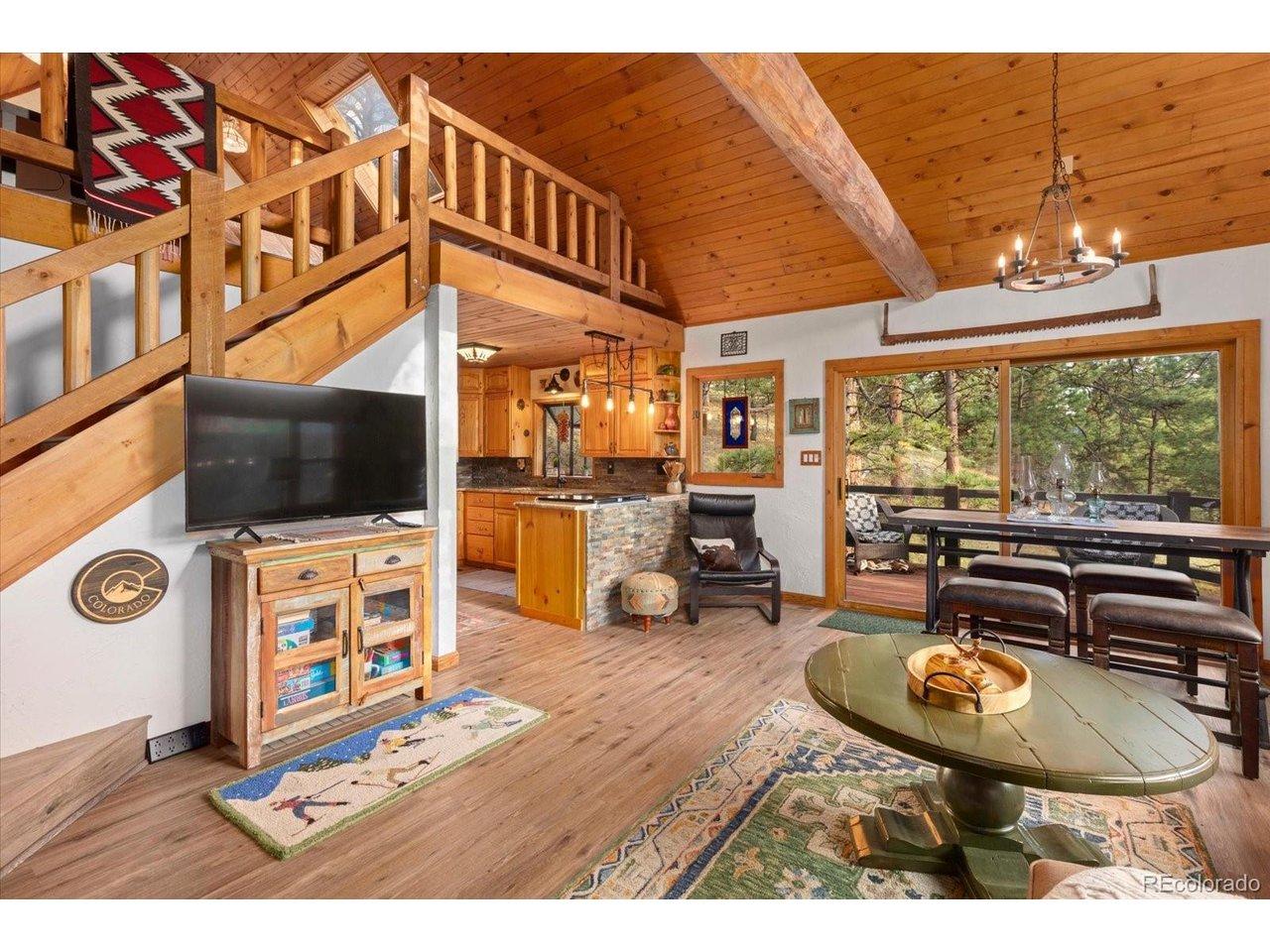 Image 4: Exposed beams and warm wood finishes throughout. Image 4: Exposed beams and warm wood finishes throughout.