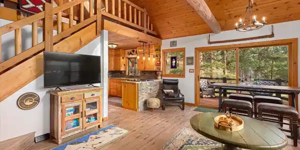 Image 4: Exposed beams and warm wood finishes throughout. Image 4: Exposed beams and warm wood finishes throughout.