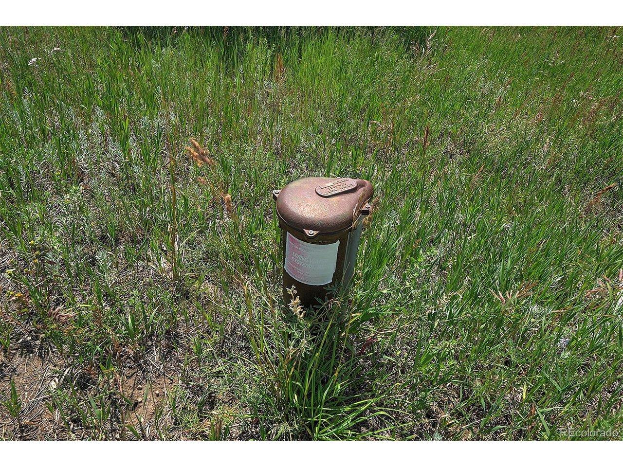 Image 4: Well head at the building site. Recent production and potability test available. Image 4: Well head at the building site. Recent production and potability test available.