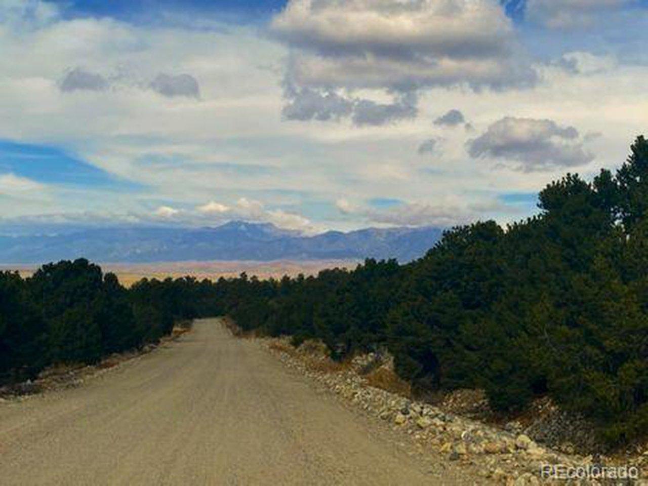 Image 1: Mill Run Road - The property is alongside the right side of this picture. Sand dunes National Monument and Sangre De Cristo Mountain range are breathtaking views. Image 1: Mill Run Road - The property is alongside the right side of this picture. Sand dunes National Monument and Sangre De Cristo Mountain range are breathtaking views.