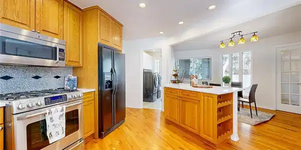 Image 2: The kitchen is open to the dining area and great room, perfect for entertaining. Image 2: The kitchen is open to the dining area and great room, perfect for entertaining.