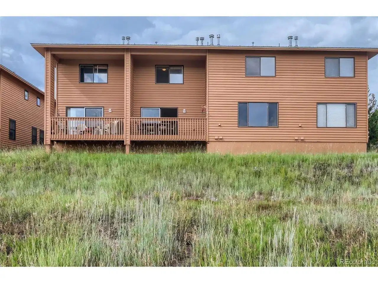 Image 1: Unit is second from the left and deck faces Lake Dillon Image 1: Unit is second from the left and deck faces Lake Dillon