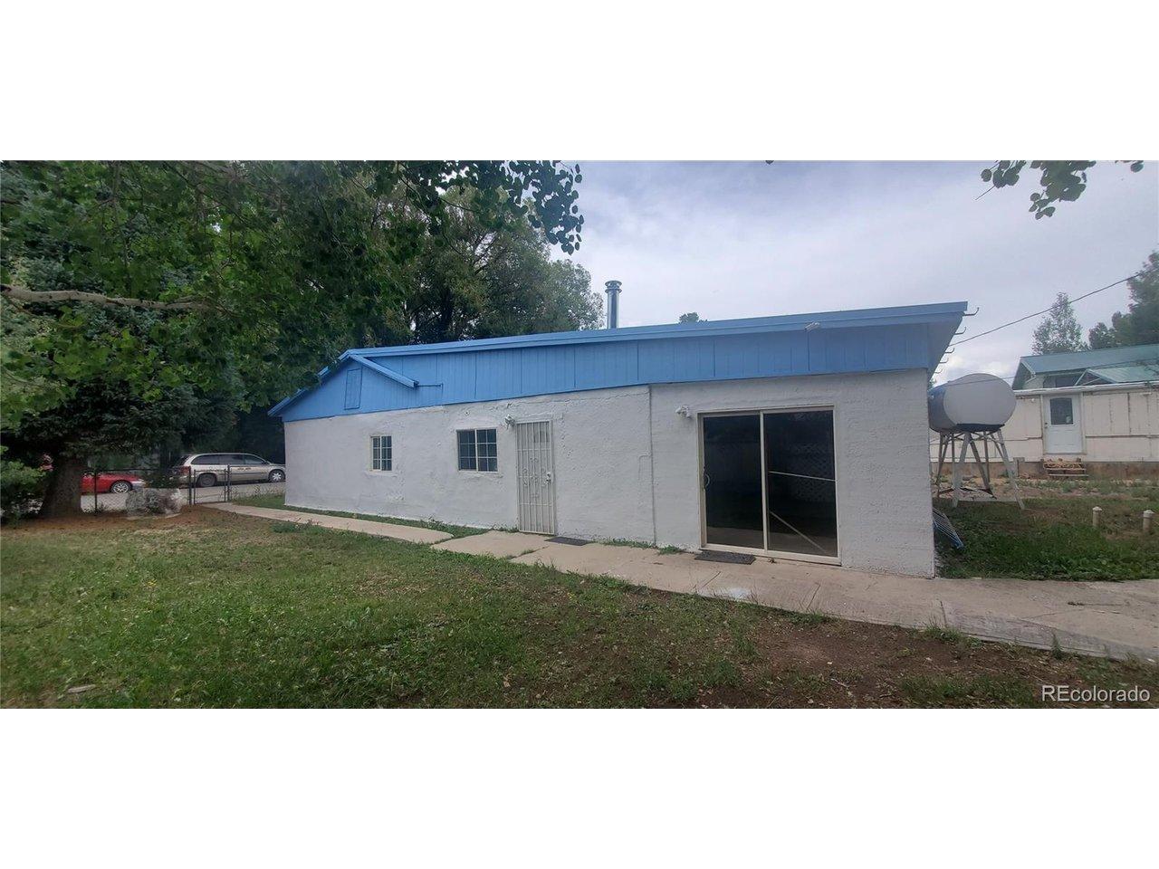 Image 1: South east side of yard and home Image 1: South east side of yard and home